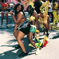 Women dancing in colorful carnival costumes
