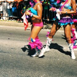 Carnival dancers in colorful feathered costumes