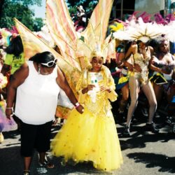 Child in yellow winged costume at parade