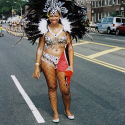 Carnival dancer in feathered headdress and costume