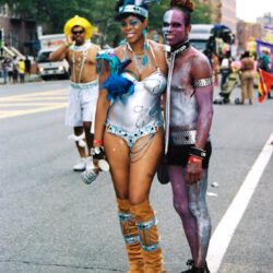Couple in colorful carnival costumes at parade