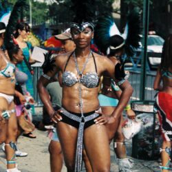 Carnival performer in silver feathered costume