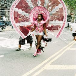 Performer in oversized pink carnival costume