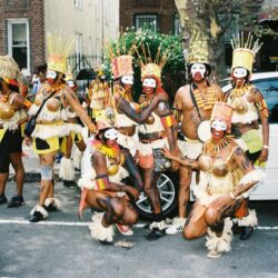 Group of costumed carnival performers with headdresses