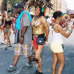 Woman in gold carnival costume and headdress