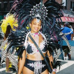 Person in elaborate black feathered carnival costume
