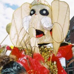 Giant elephant parade puppet with red costume