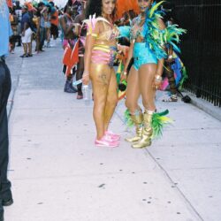 Two women in colorful carnival costumes