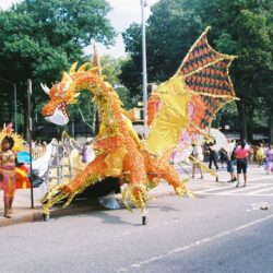 Golden dragon parade float at street festival