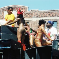 Carnival dancers in glittery bikinis on float