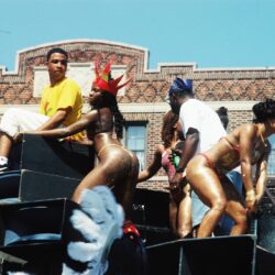 Parade float with bikini-clad dancers