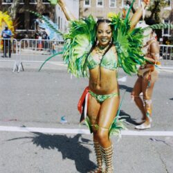 Carnival dancer in green feathered costume