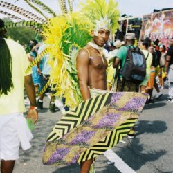 Person in vibrant yellow-green carnival costume