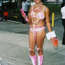 Smiling woman wearing pink carnival costume