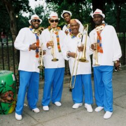 Outdoor brass band in white and blue outfits