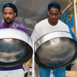 Two musicians playing steelpan drums