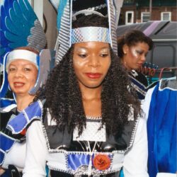 Women in blue and silver carnival costumes