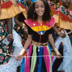 Smiling girl in colorful parade costume