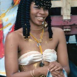 Smiling woman in beaded carnival costume