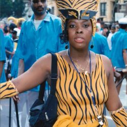 Woman in tiger-striped costume at city parade