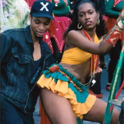 Female carnival dancer in vibrant yellow costume