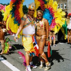 Colorful carnival dancers with large feathered wings