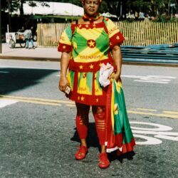 Woman wearing Grenada flag colors at parade