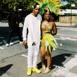 Two people at street carnival in costumes