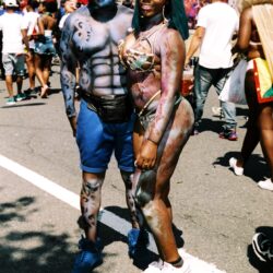 Couple in colorful body paint at street parade