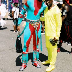 Two men in colorful festival outfits