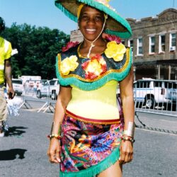 Smiling person in colorful carnival costume