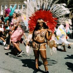 Carnival dancer in red feathered costume