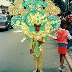 Child in elaborate green and gold carnival costume