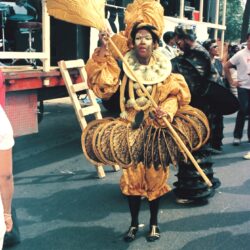 Performer in elaborate gold carnival costume