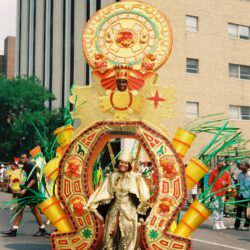 Parade performer in ornate gold carnival costume