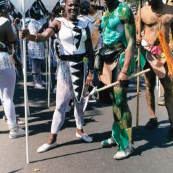 People in body paint and tribal costumes