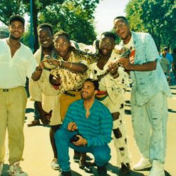Group of friends laughing outdoors at festival