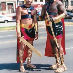 Two people in warrior costumes holding swords