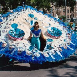 Person in elaborate blue circular carnival costume