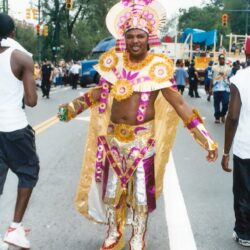 Man in colorful carnival costume parading