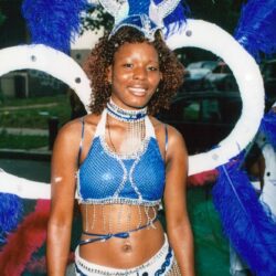Woman in blue feathered carnival costume