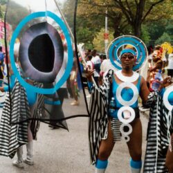 Parade performer in blue circular carnival costume