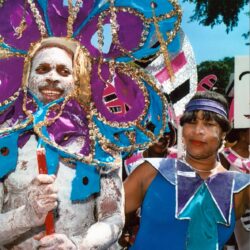 Two people in colorful carnival costumes