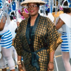 Woman in patterned robe and straw hat