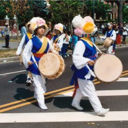 Parade drummers in colorful traditional costumes