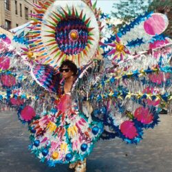 Performer in colorful oversized carnival parade costume