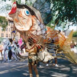 Giant colorful fish costume in street parade