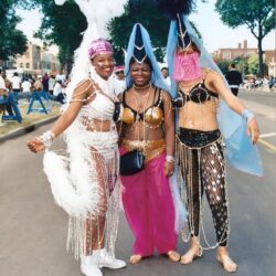 Three people in elaborate carnival costumes