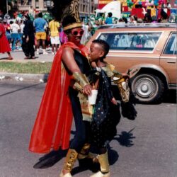 Two people in carnival costumes dancing
