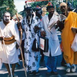 Group of costumed men walking in parade